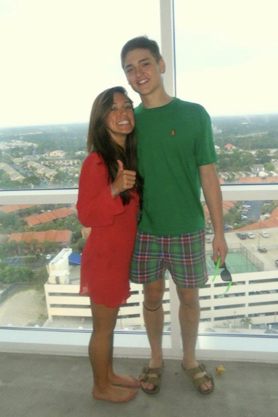 Chazlyn and Nicolas on a balcony above the city