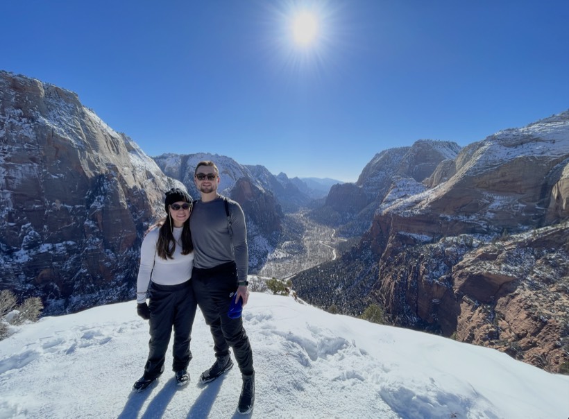 Chazlyn and Nicolas in the snow above a canyon